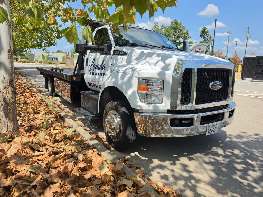 Lozada Towing Ford heavy-duty commercial flatbed truck